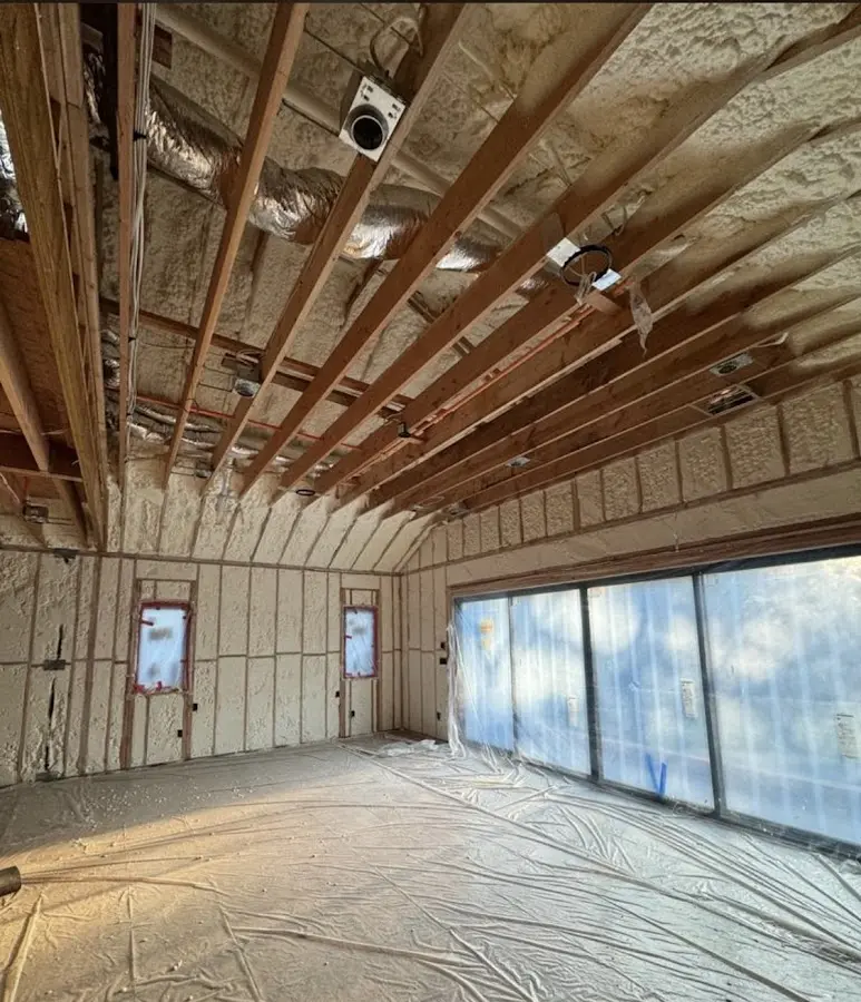 Interior walls and ceiling insulated with spray foam during new construction in Loudon